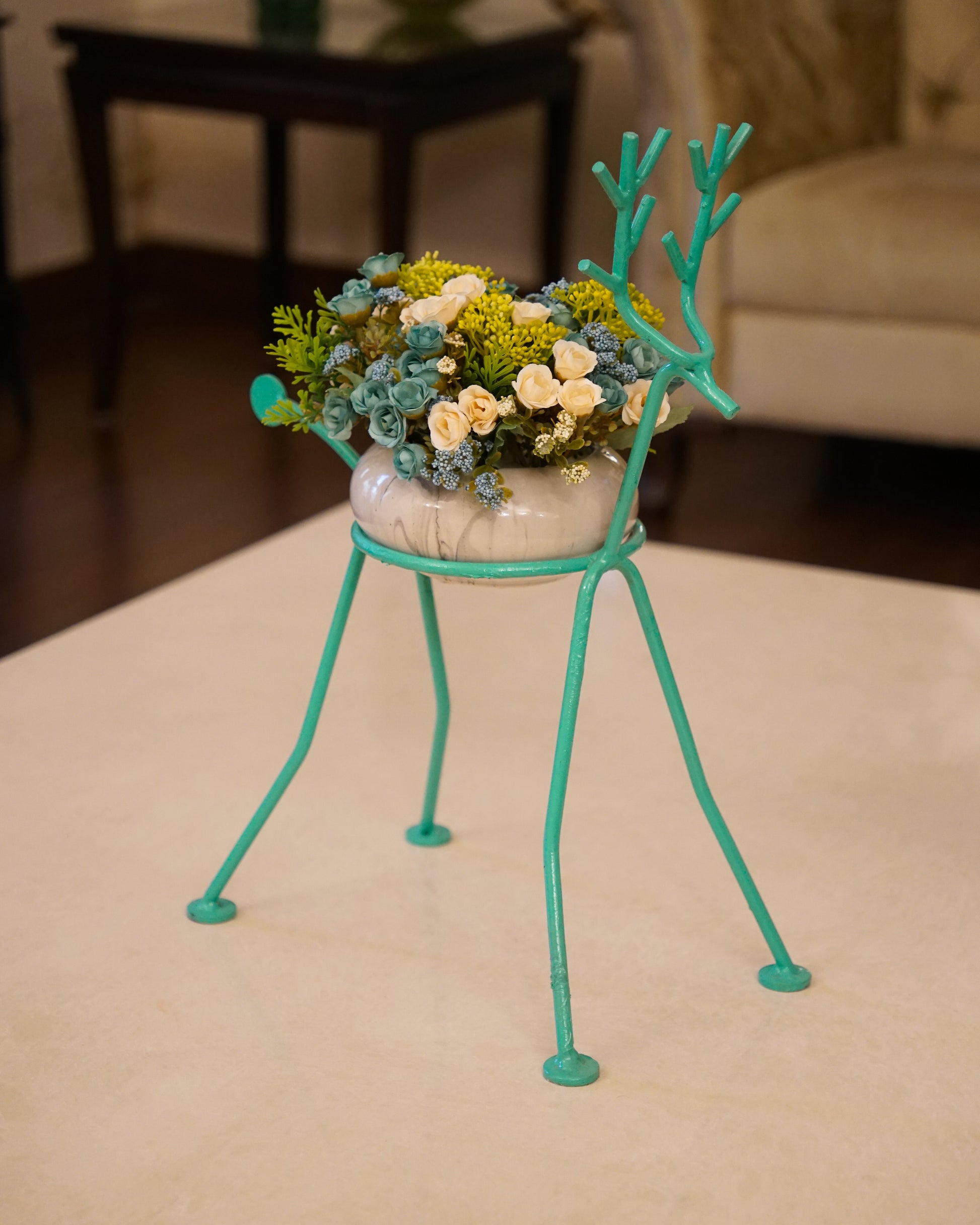 Deer plant stand with flower arrangement