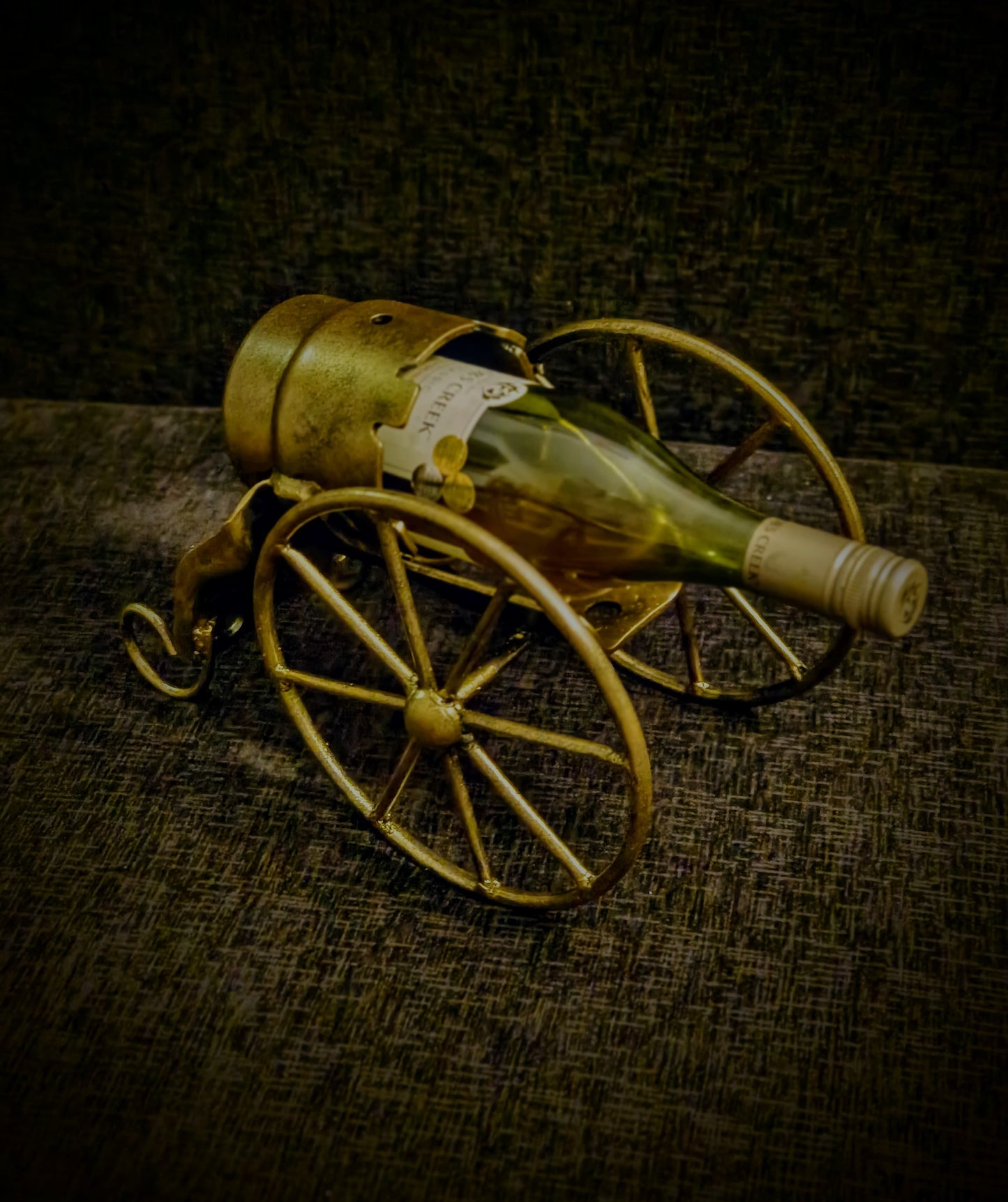 Liquor bottle holder with bottle in cannon shape